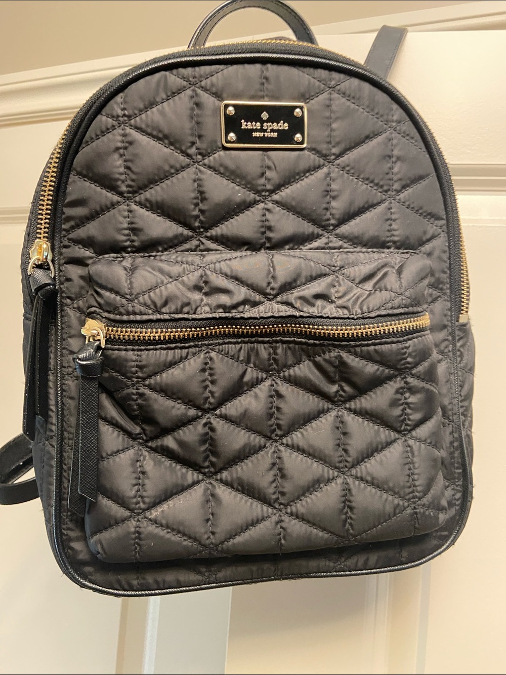 kate spade black quilted mini backpack with gold hardware